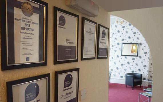 Awards on hallway wall inside Ashwood Hotel.