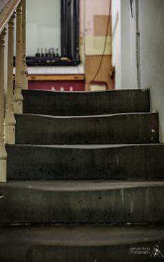 Old stone steps in unseen parts of The Harris, warped in shape over time.