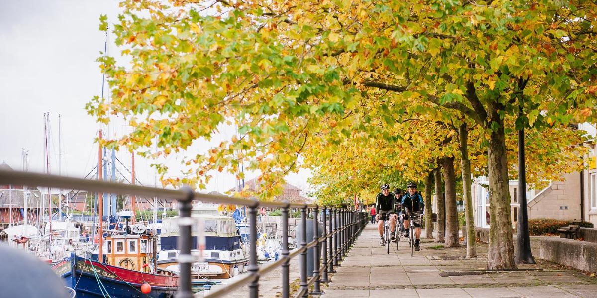 People cycling at Preston Docks