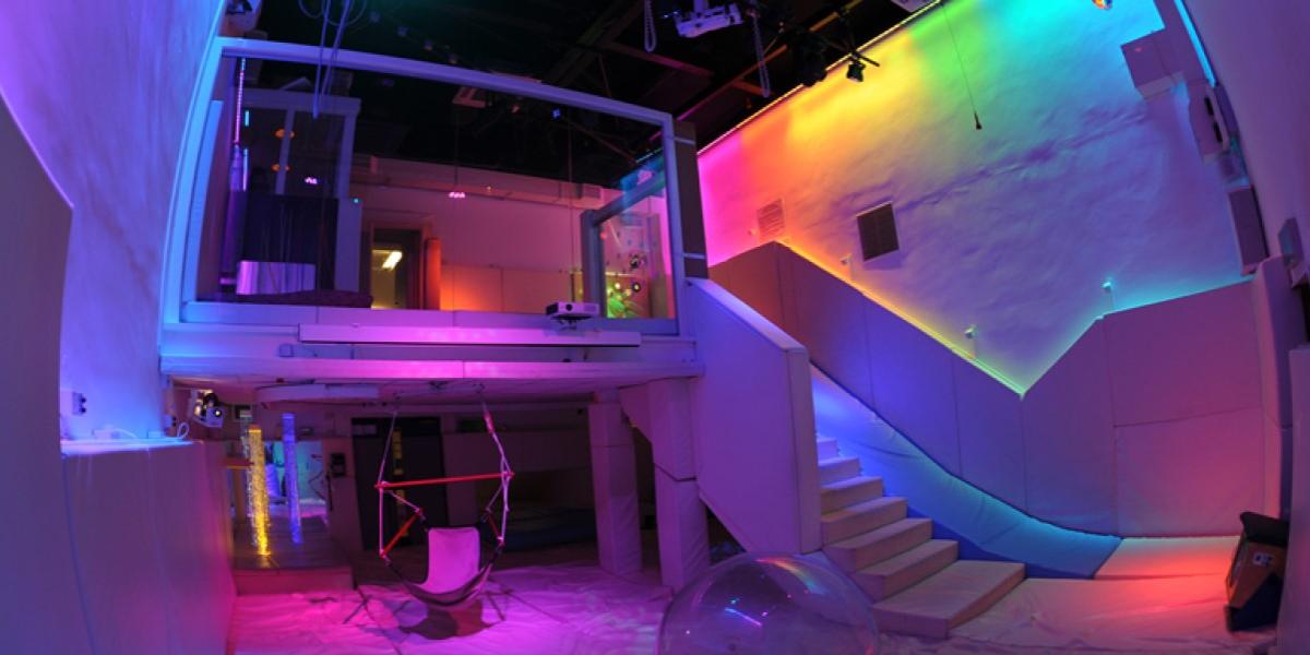 The Space Centre's padded and brightly coloured playroom with projectors and chair swing