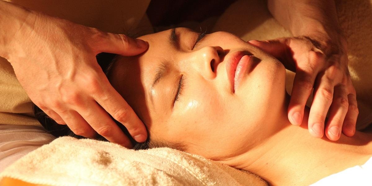 Woman having face massage