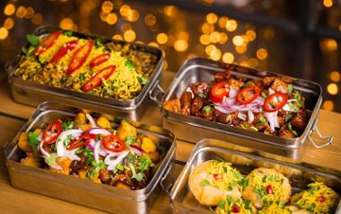 A close up look at the tiffin boxes full of delicious Indian food