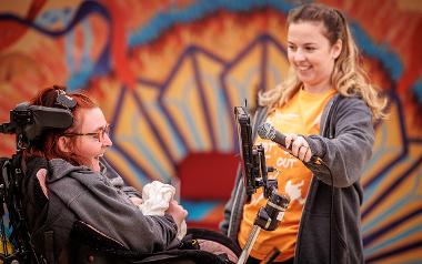 Person in wheelchair speaking on the microphone