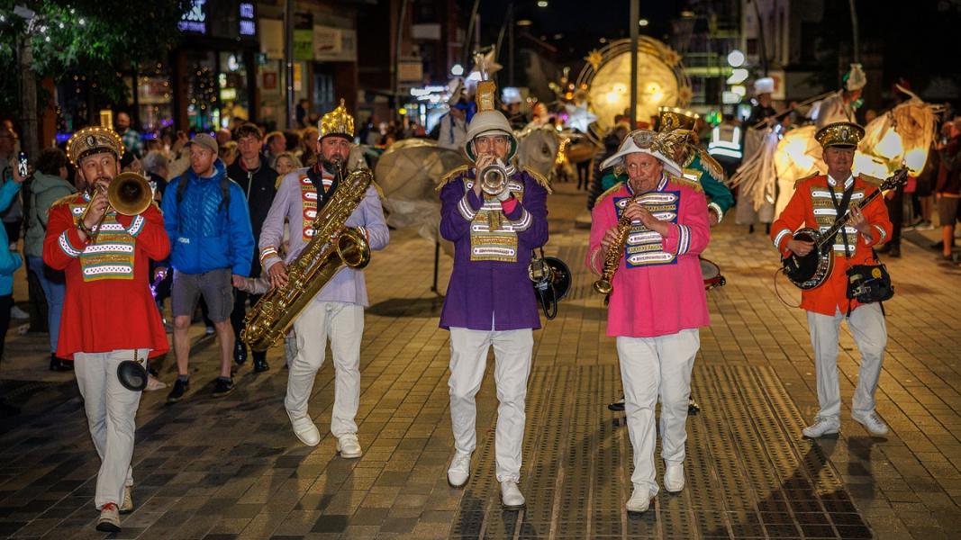 Brass band playing in torchlight procession