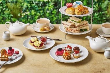 Afternoon tea with sandwiches, cakes and tea