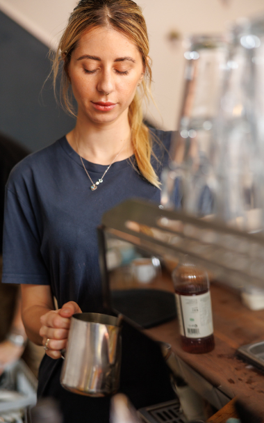 Waitress making coffee