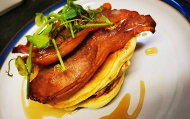 A close up of a pancake and bacon dish from Ravenous cafe