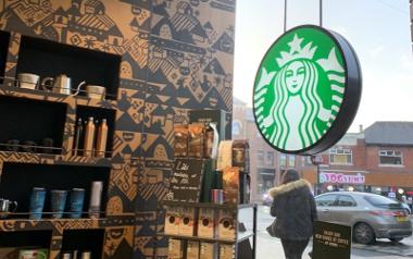 Inside Starbucks Fishergate looking out the window with a Starbucks logo and merchandise stand