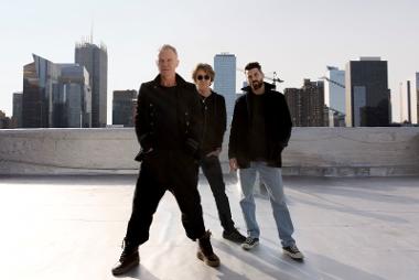 Sting and his band members pose for a group photo