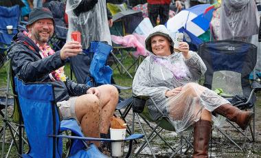 People enjoying the event in the rain