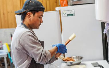 Nischal preparing corndogs