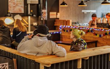 People sat at tables inside Lakhey Street Food