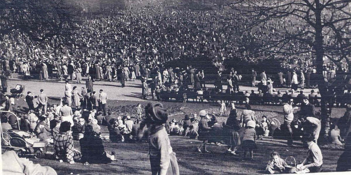 Old black and white photograph of Preston's annual egg rolling event taking place on Avenham Park.