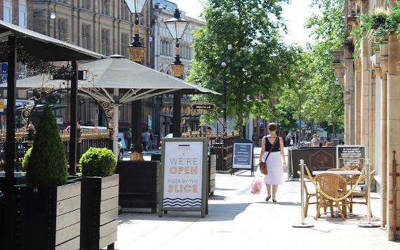 Woman shopping along Fishergate high street.