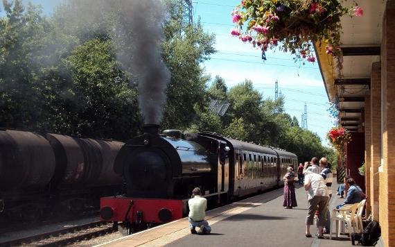 Visitors waiting on platform to board a steam train at Ribble Steam Railway and Museum.