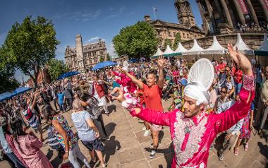 Crowds dancing on Preston Flag Market during Mela event. Photo by Michael Porter.