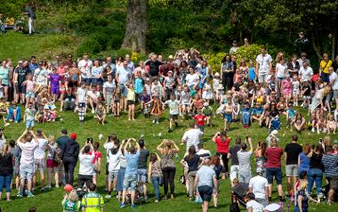 Group getting ready to roll their eggs down Avenham Park hill at annual Egg Rolling event.