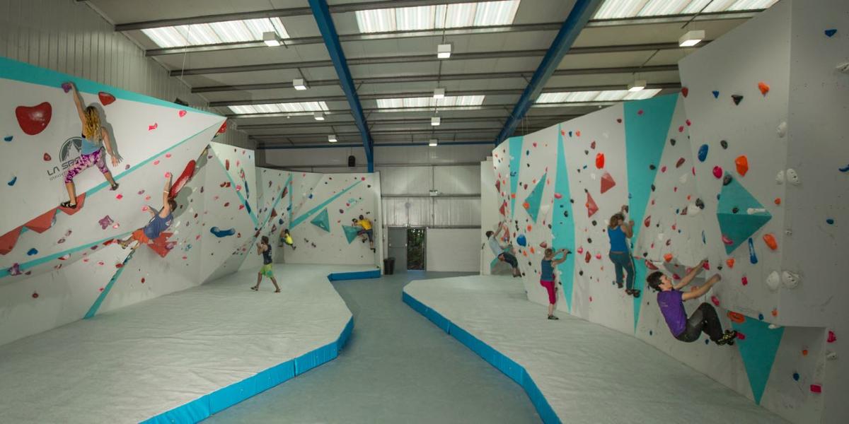 Climbers on indoor climbing wall in Boulder UK.