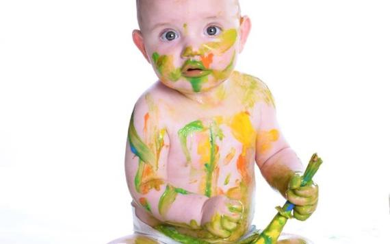 Baby covered in Paint.