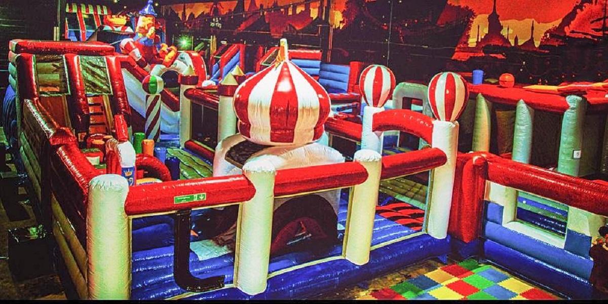 Inflatable assault course indoors at Jump Maniax.