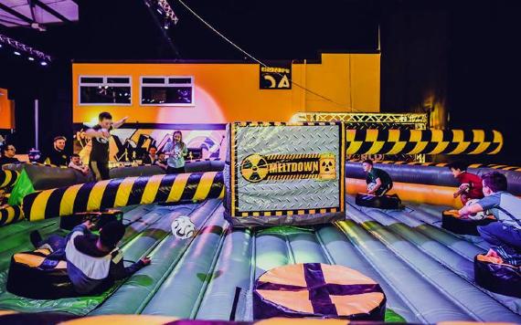 Children playing on inflatable game.