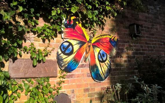 Butterfly wall decoration at Ashton Park's peace gardens.