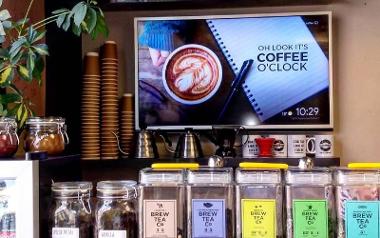 Tea and coffee on display around Cedarwood Coffee Co. counter.