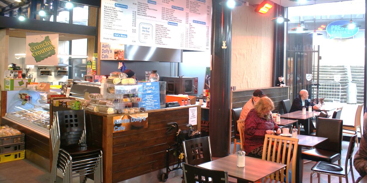 Diners inside Aunt Dolly's Cafe, inside Preston Market Hall.