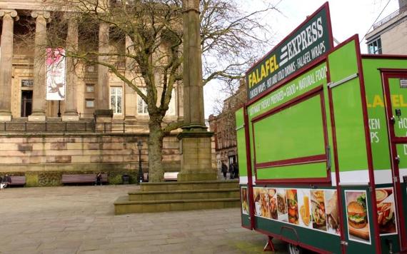 Falafel Express vendor before opening in morning on Preston Flag Market.