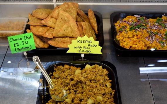 Assortment of curry and side dishes at Momoz Street Food.