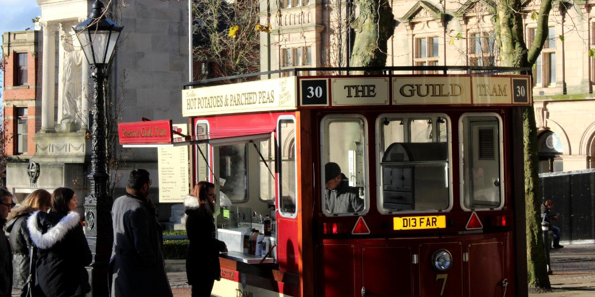 Queue outside The Hot Potato Tram on Preston Flag Market.