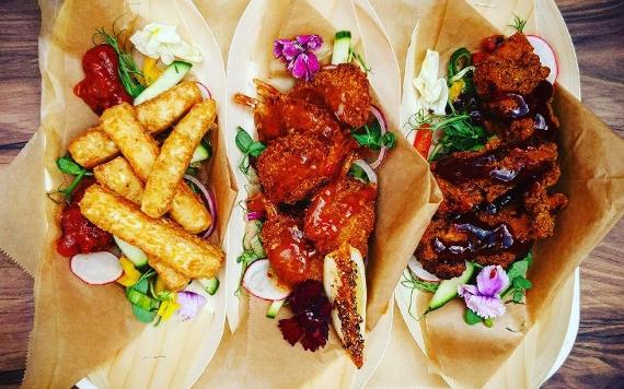 Three small plates on a tray inside Hartleys Wine Bar.