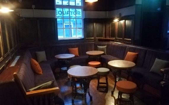 Large comfy booth seating area inside Vinyl Tap Preston.