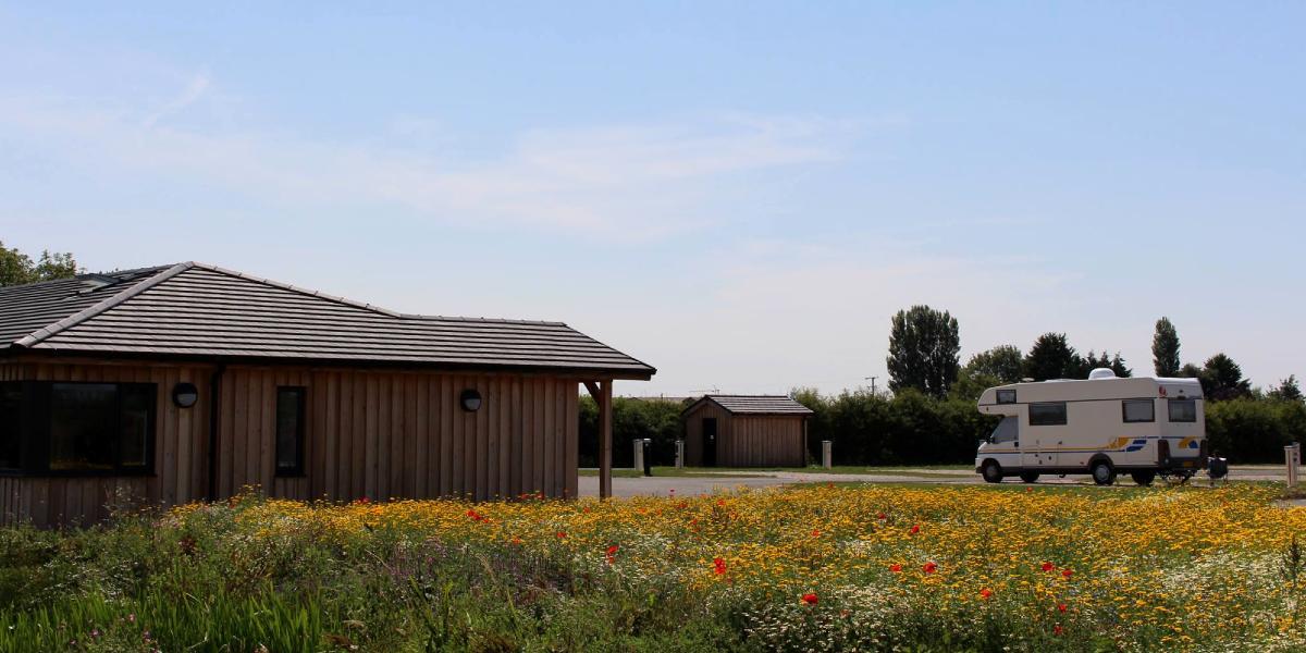 Donkey Creek Farm main building and caravan parked up.