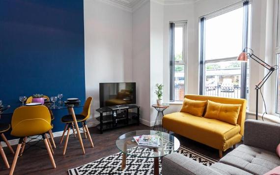 Fulwood Heights living room with yellow, grey, and blue decor.