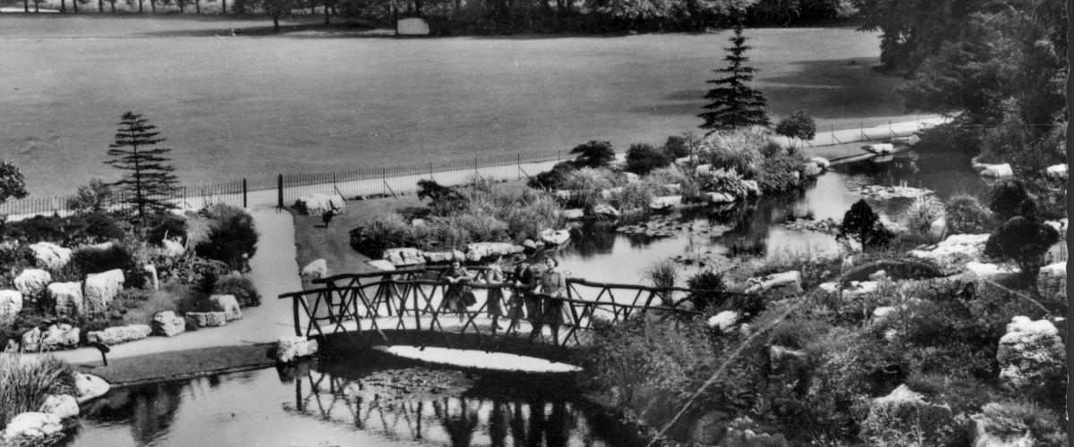 Vintage photo of group stood in Avenham Park's Japanese Gardens.