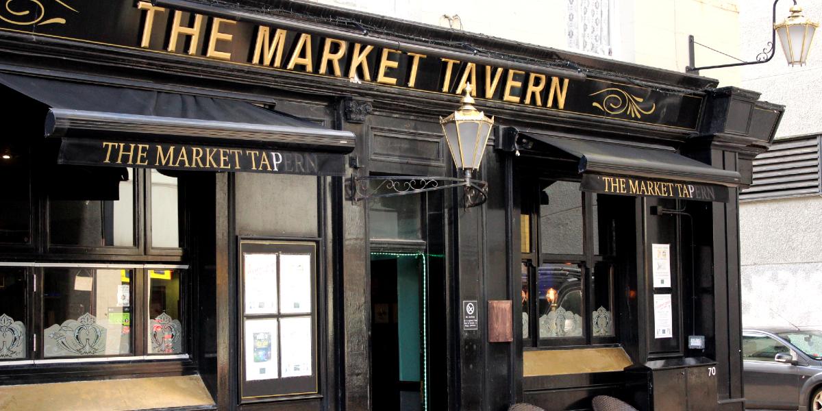 Black and gold exterior of The Market Tavern Preston.