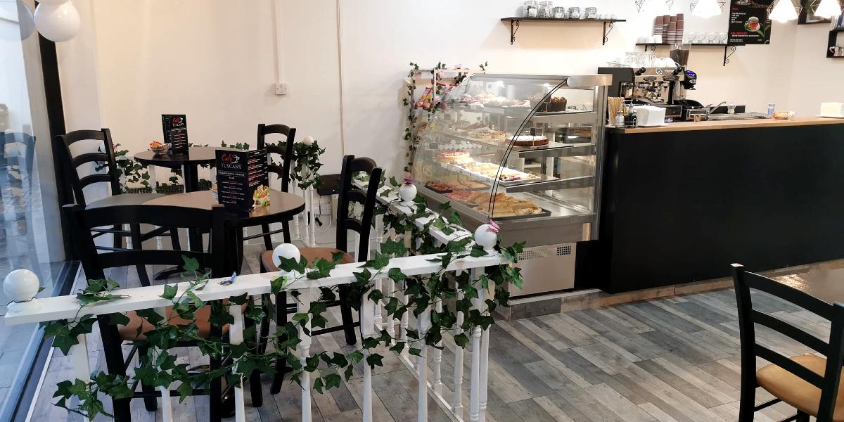 Seating and café counter inside Preston's Tuscany Café in Plungington.