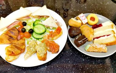 Afternoon Tea for one displayed on table inside Tuscany Café .